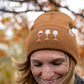 Woman wearing brown wine glass beanie
