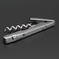 Silver corkscrew on a dark gray background