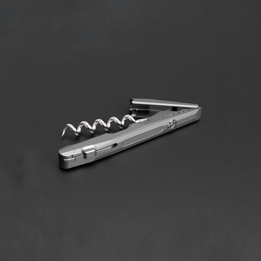 Metallic corkscrew on a dark gray background